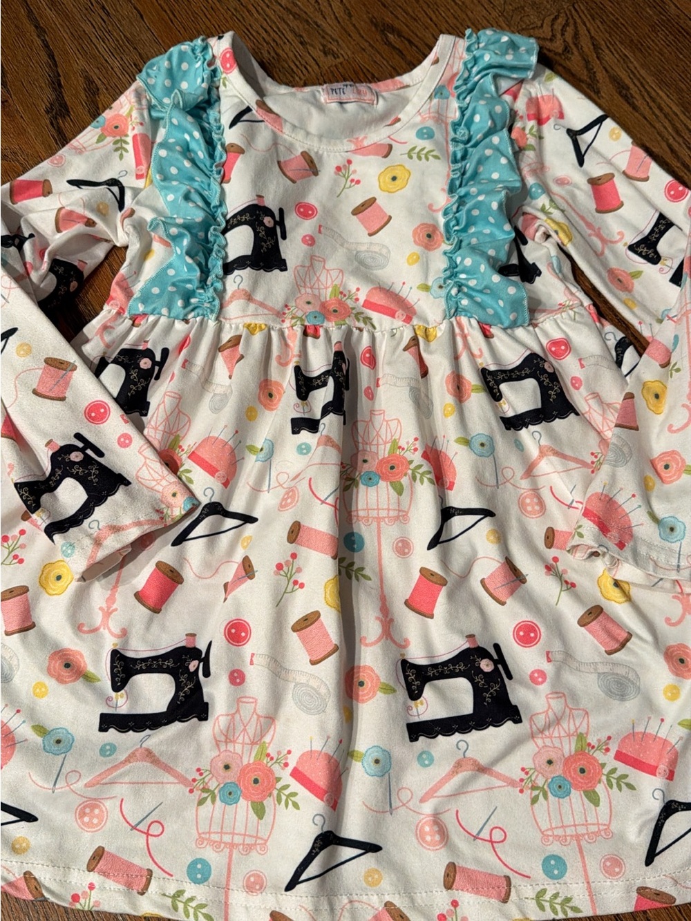 Pete + Lucy Girls Sewing Theme Long Sleeve Dress in White with Aqua Ruffle 7/8